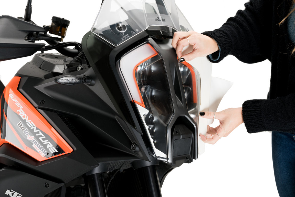 Adhere headlight protector PUIG 21444W transparent for KTM Super Adventure 1290 / R / S 2021-2025